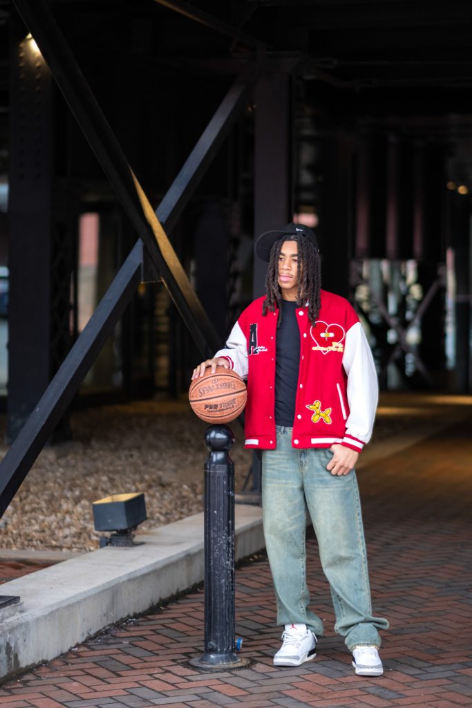 Richmond_Senior_Portraits-21 Professional senior portrait of boy with basketball in downtown location.