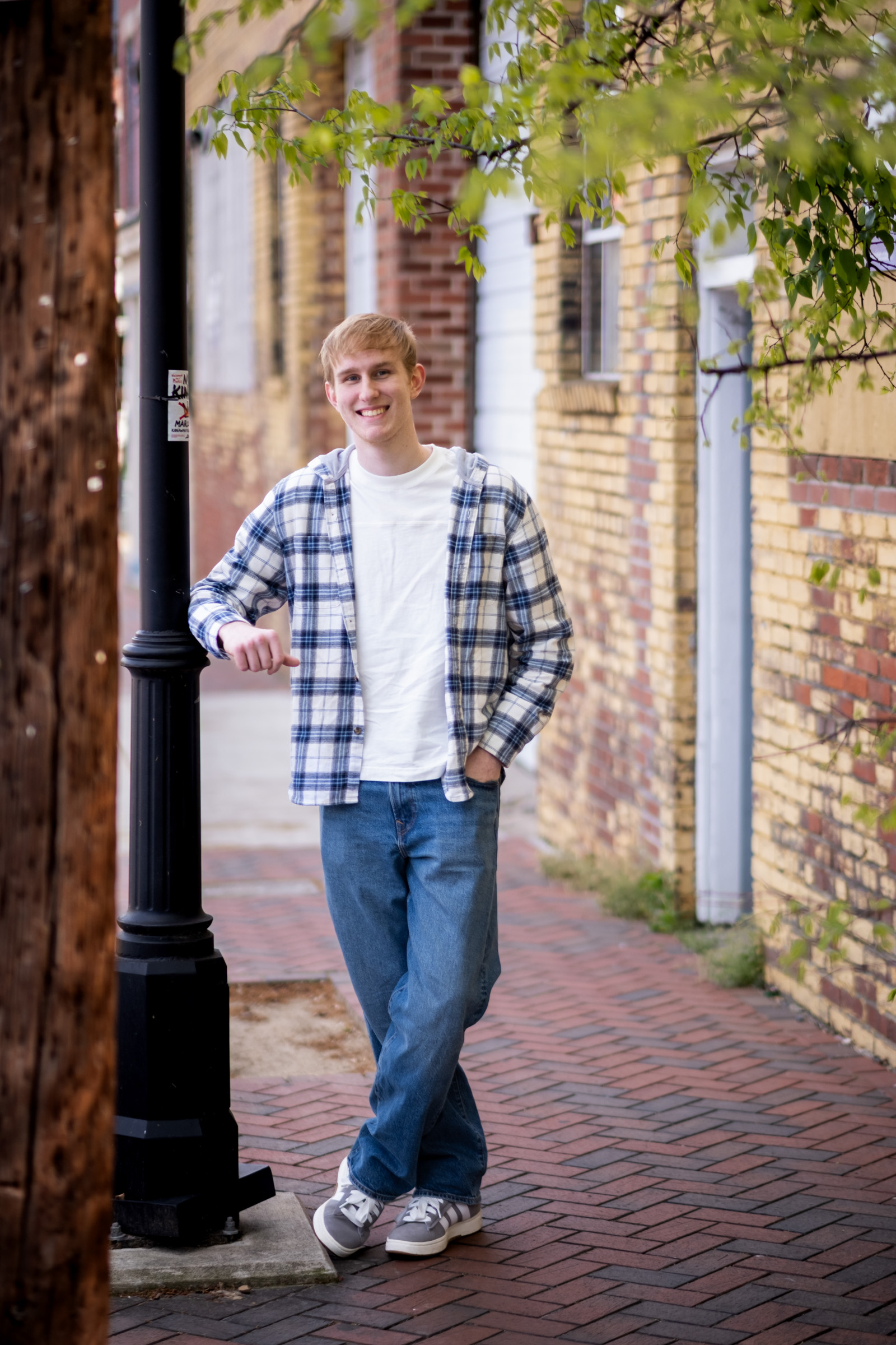 Richmond_Senior_Portraits-30 Richmond Senior Pictures of Homeschooled Boy in Downtown Setting Standing on Sidewalk