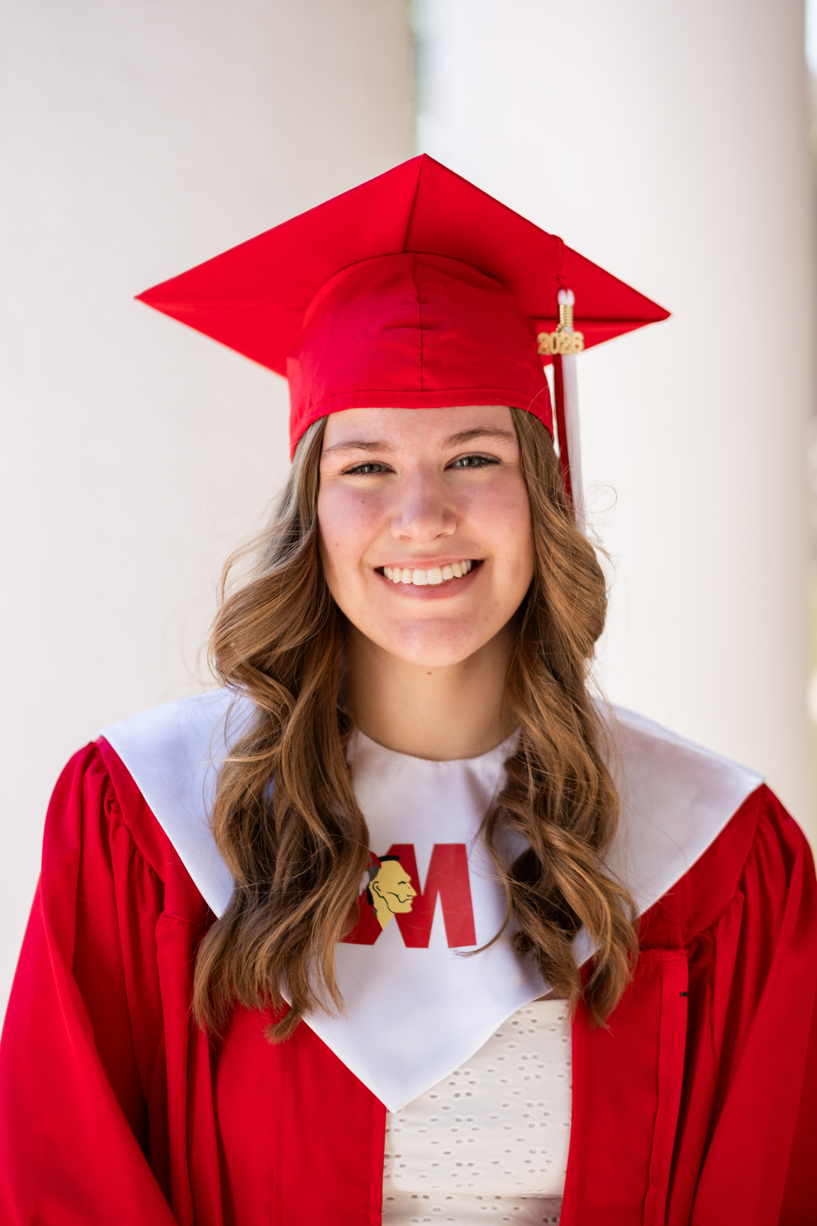 Richmond_Senior_Portraits-39 Professional Senior Picture of Girl with Cap and Gown Smiling at the Camera