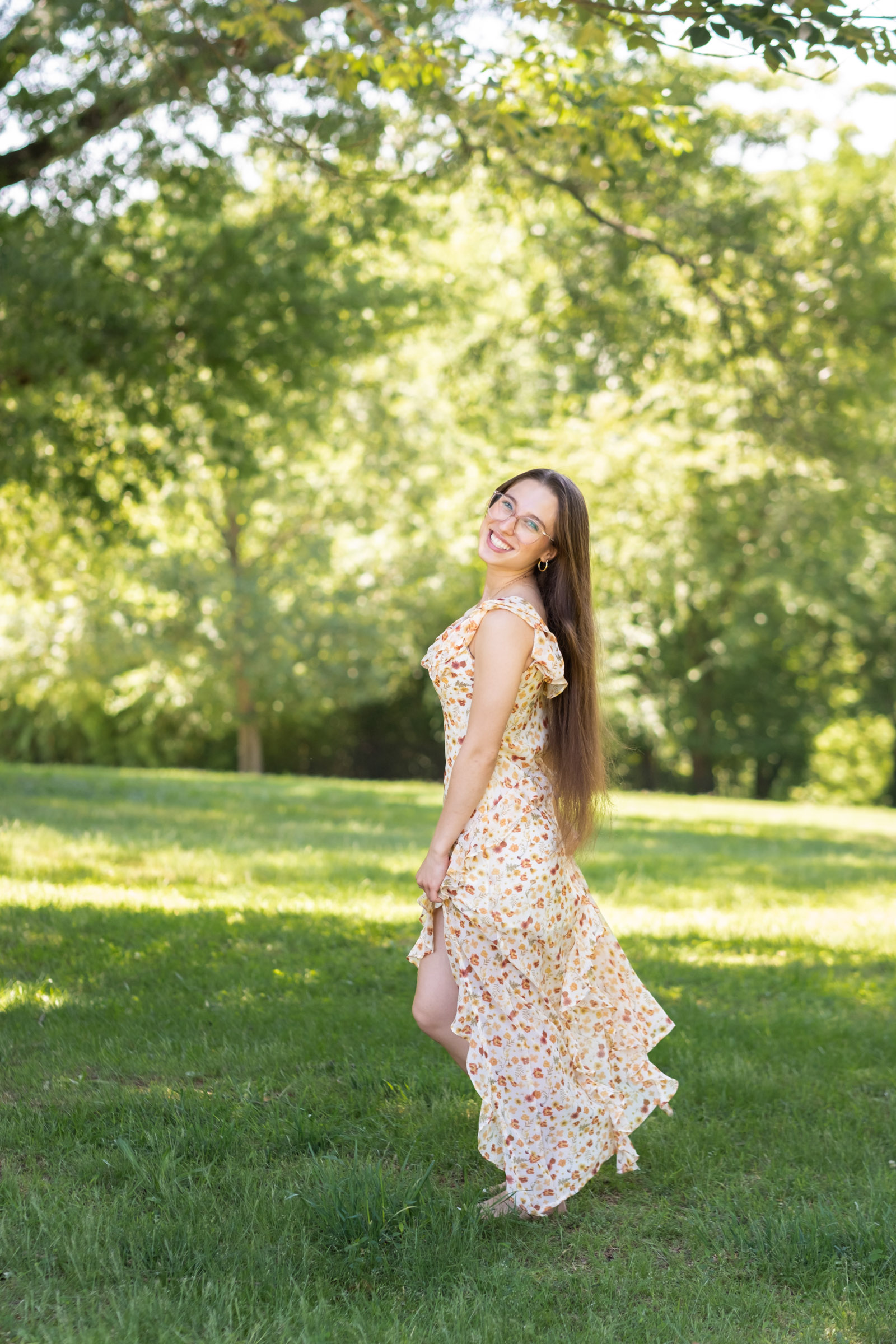 Richmond_Senior_Portraits-60 Whimsical Senior Picture of girl in field on sunny day in a dress
